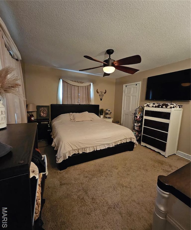 22 Settlers Trl, Hannibal, MO 63401 - bedroom with a textured ceiling, carpet floors, and a ceiling fan
