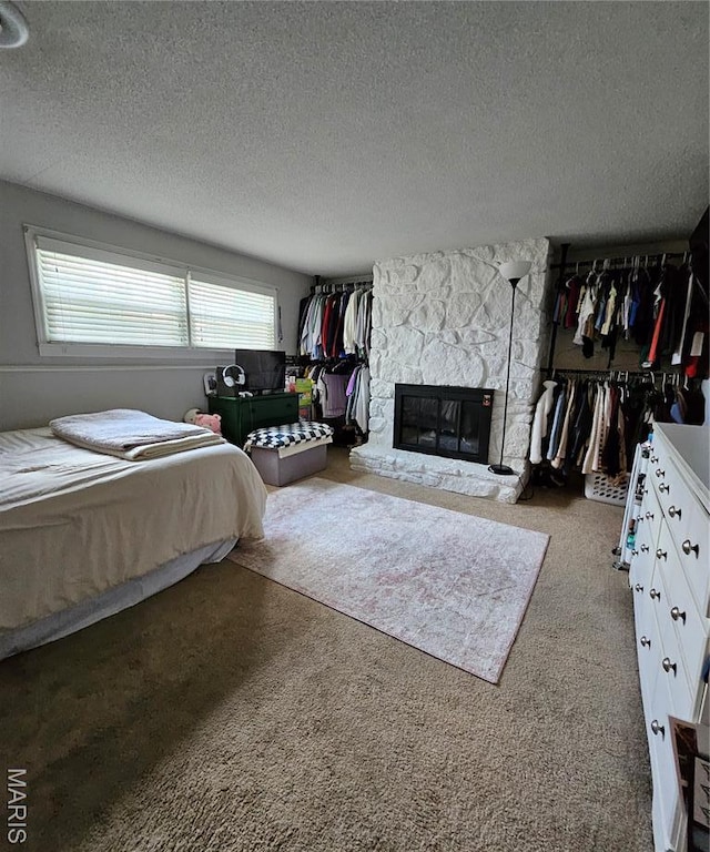 22 Settlers Trl, Hannibal, MO 63401 - bedroom featuring carpet floors, a stone fireplace, and a textured ceiling