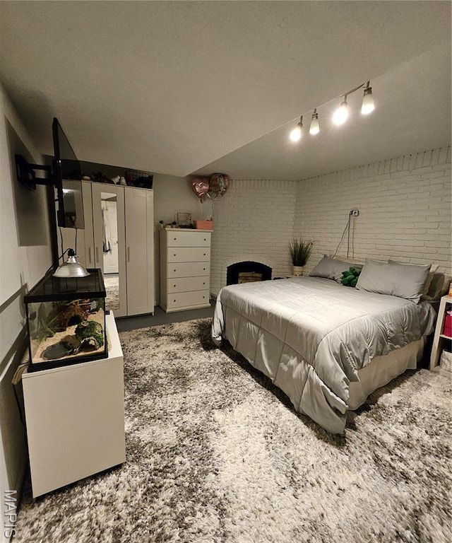 22 Settlers Trl, Hannibal, MO 63401 - bedroom featuring brick wall and a brick fireplace
