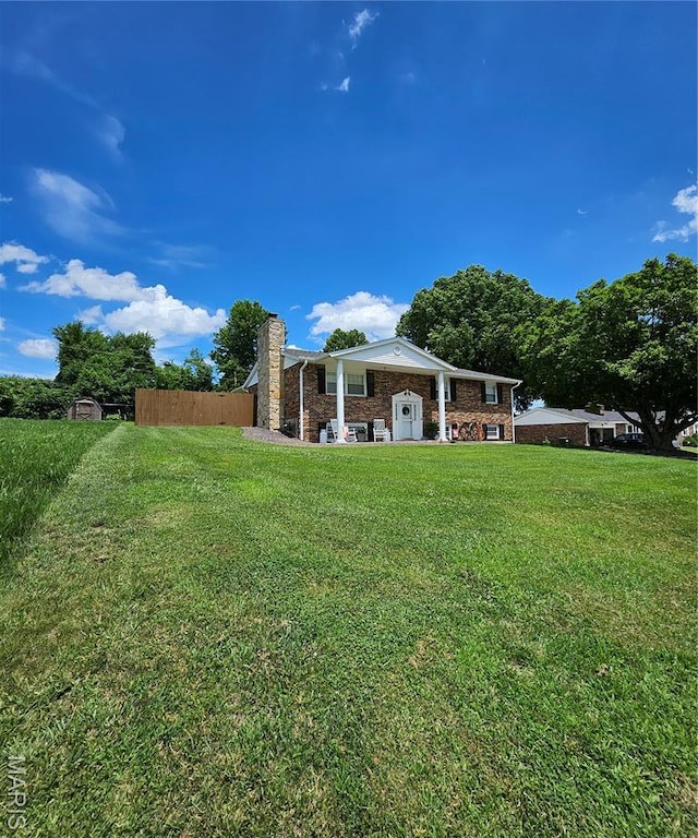 22 Settlers Trl, Hannibal, MO 63401 - rear view of house featuring a chimney