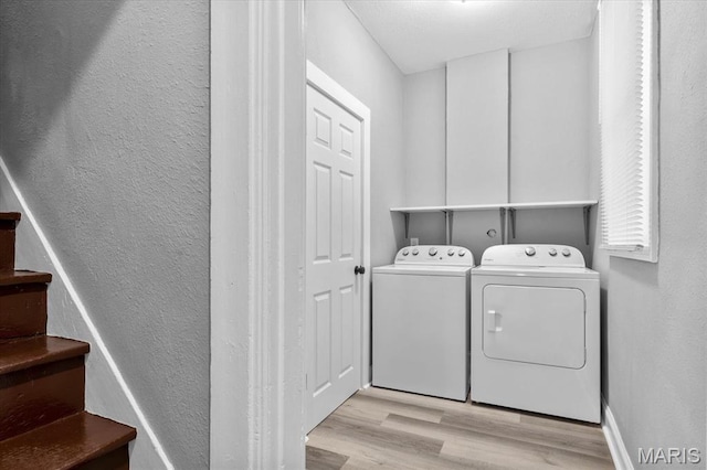 207 N 13th St, Belleville, IL 62220 - laundry area featuring washing machine and clothes dryer, wood finished floors, and a textured wall