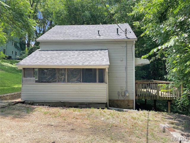 100A Wall St, New Haven, MO 63068 - view of side of home featuring a sunroom, a wooden deck, and a shingled roof