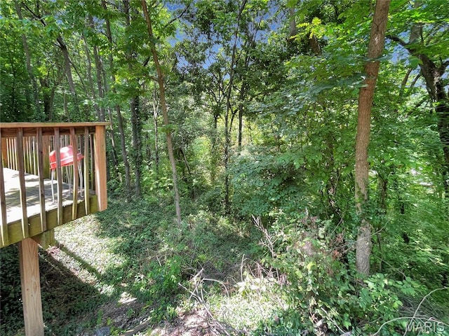 100A Wall St, New Haven, MO 63068 - view of yard featuring a wooden deck and a wooded view