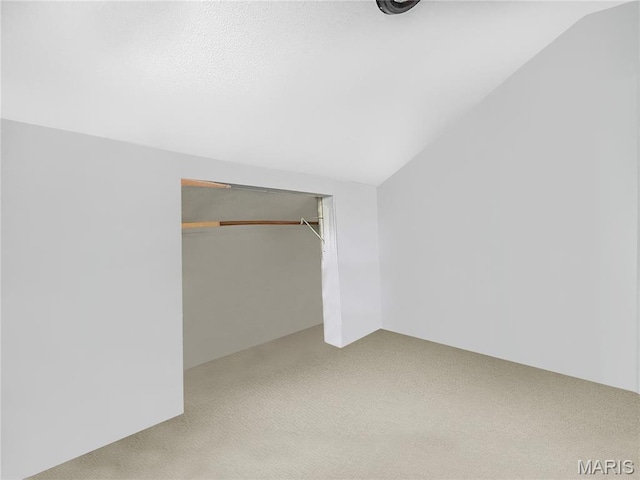 100A Wall St, New Haven, MO 63068 - unfurnished bedroom featuring carpet, vaulted ceiling, and a closet