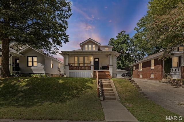 505 Sycamore St, Belleville, IL 62220 - bungalow-style house with stairway, covered porch, and a front yard