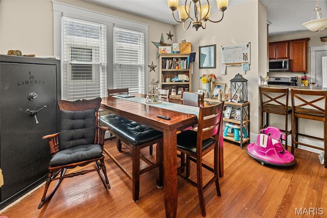 505 Sycamore St, Belleville, IL 62220 - dining room featuring light wood-type flooring and a chandelier