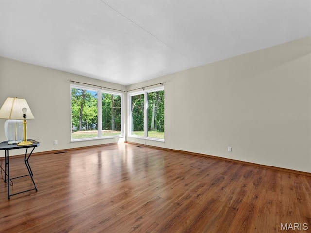 4488 Rock Creek Valley Rd, House Springs, MO 63051 - spare room featuring wood finished floors