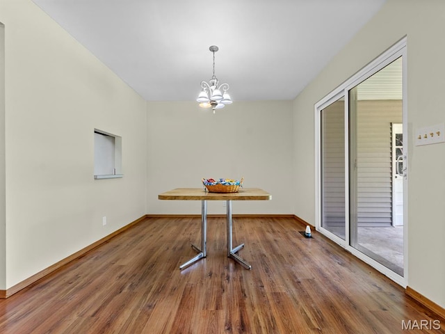 4488 Rock Creek Valley Rd, House Springs, MO 63051 - unfurnished dining area featuring a chandelier and wood finished floors