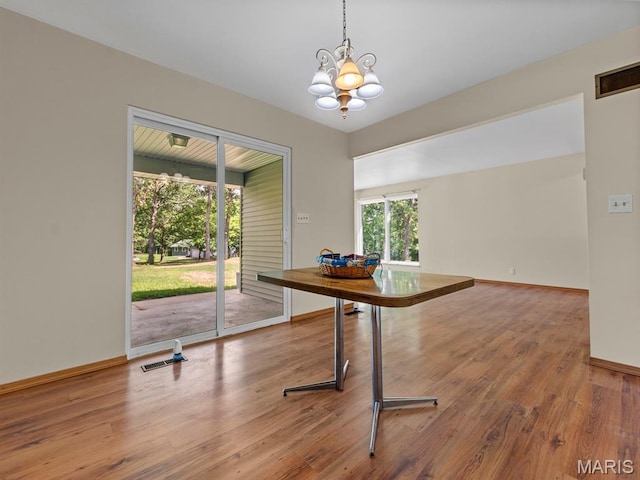 4488 Rock Creek Valley Rd, House Springs, MO 63051 - office space with a chandelier and wood finished floors