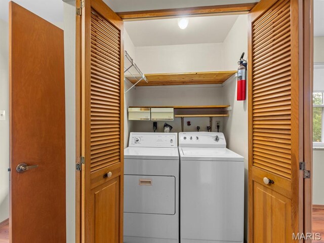 4488 Rock Creek Valley Rd, House Springs, MO 63051 - laundry area featuring washing machine and clothes dryer and wood finished floors