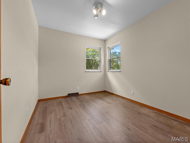 4488 Rock Creek Valley Rd, House Springs, MO 63051 - empty room with wood finished floors and baseboards