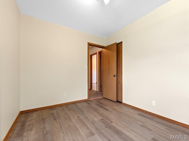 4488 Rock Creek Valley Rd, House Springs, MO 63051 - empty room with wood finished floors and baseboards