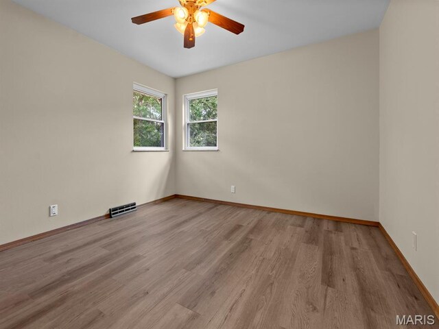 4488 Rock Creek Valley Rd, House Springs, MO 63051 - spare room featuring ceiling fan and wood finished floors
