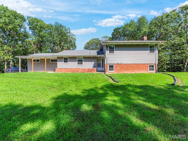4488 Rock Creek Valley Rd, House Springs, MO 63051 - rear view of property featuring a chimney, a lawn, and brick siding
