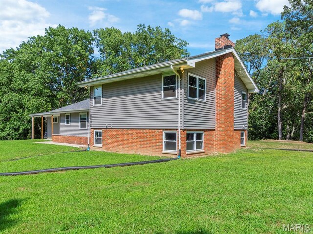 4488 Rock Creek Valley Rd, House Springs, MO 63051 - view of property exterior featuring a chimney and a yard