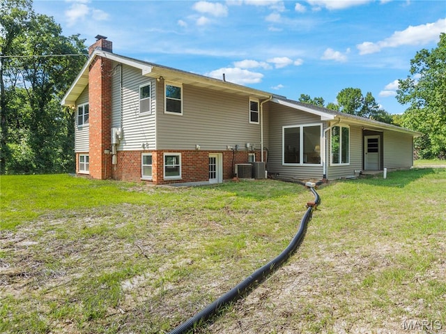 4488 Rock Creek Valley Rd, House Springs, MO 63051 - back of property featuring a chimney and a lawn