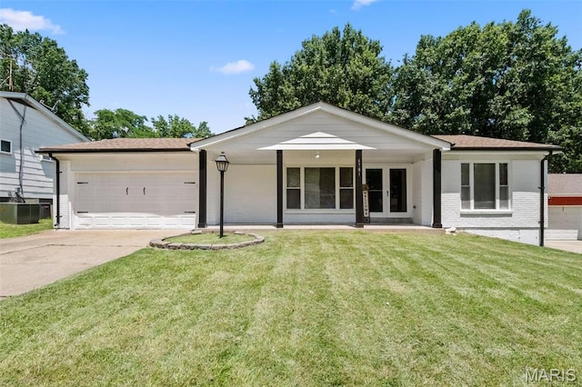 6781 Lesli Mari Ct, Florissant, MO 63033 - ranch-style house with french doors, a garage, brick siding, driveway, and a front lawn