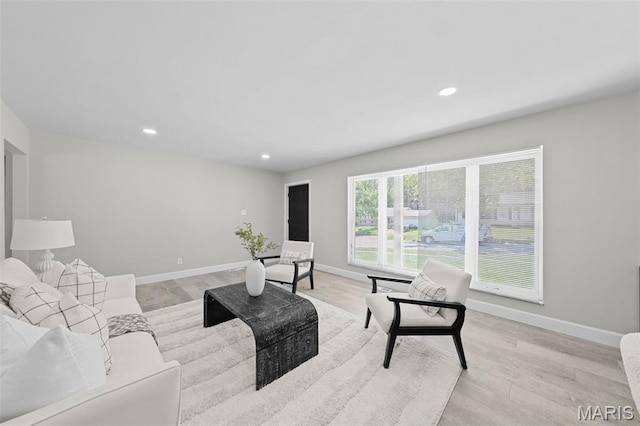 6781 Lesli Mari Ct, Florissant, MO 63033 - living room with recessed lighting and light wood finished floors