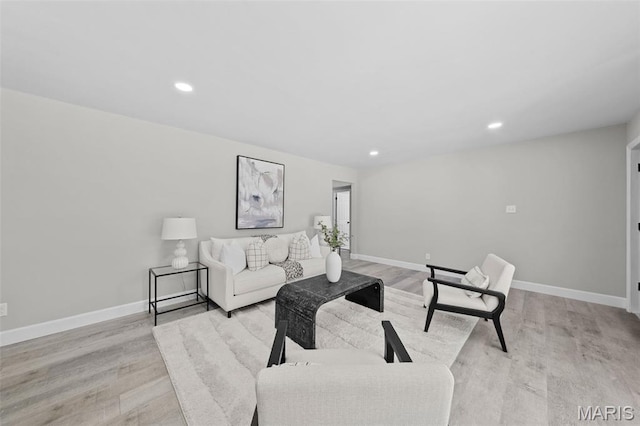 6781 Lesli Mari Ct, Florissant, MO 63033 - living room featuring light wood-type flooring and recessed lighting