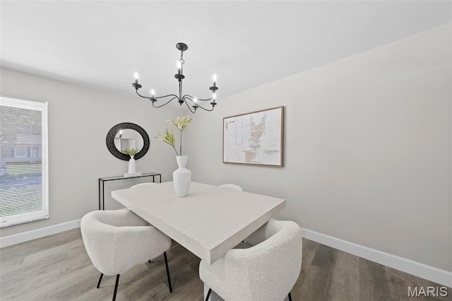 6781 Lesli Mari Ct, Florissant, MO 63033 - dining space featuring a chandelier and wood finished floors
