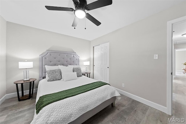 6781 Lesli Mari Ct, Florissant, MO 63033 - bedroom with wood finished floors, a closet, and ceiling fan