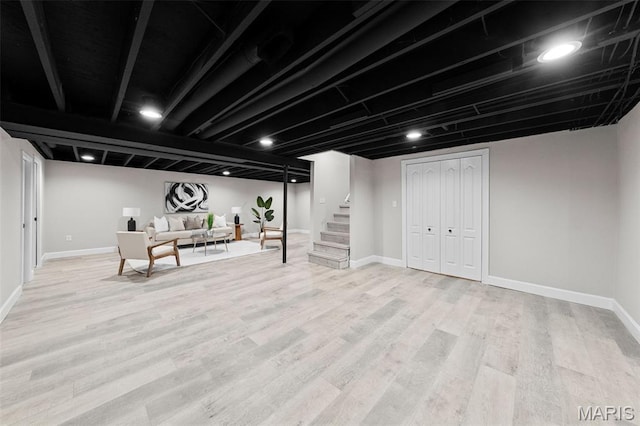 6781 Lesli Mari Ct, Florissant, MO 63033 - finished basement with stairway and light wood finished floors