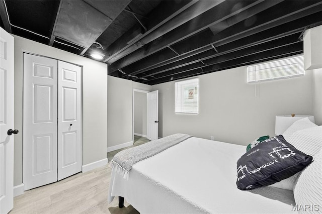 6781 Lesli Mari Ct, Florissant, MO 63033 - bedroom with light wood-style flooring and a closet