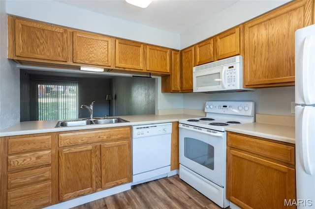 1989 Hunting Lake Ct Unit 201, Kirkwood, MO 63122 - kitchen featuring white appliances, light countertops, wood finished floors, and brown cabinetry