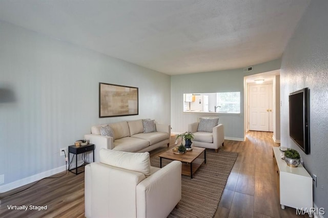 1989 Hunting Lake Ct Unit 201, Kirkwood, MO 63122 - living room featuring wood finished floors and baseboards