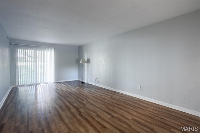 1989 Hunting Lake Ct Unit 201, Kirkwood, MO 63122 - unfurnished room featuring dark wood-style flooring