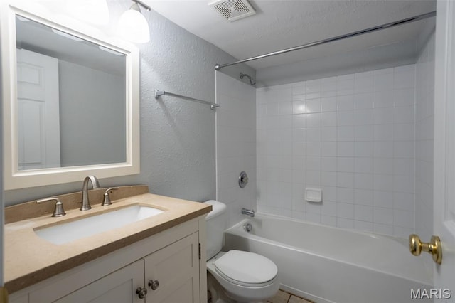 1989 Hunting Lake Ct Unit 201, Kirkwood, MO 63122 - bathroom featuring a textured wall, vanity, and bathing tub / shower combination