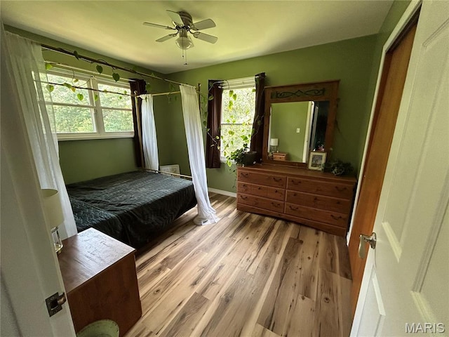 8705 State Road Y, Dittmer, MO 63023 - bedroom featuring wood finished floors and a ceiling fan