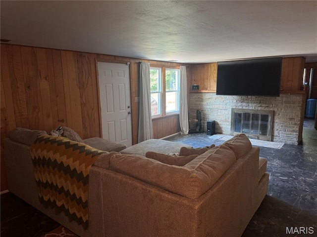 8705 State Road Y, Dittmer, MO 63023 - living room featuring wooden walls and a glass covered fireplace