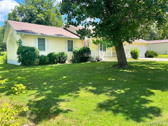 402 N Viola St, Bloomfield, MO 63825 - view of front of property featuring a porch, an attached garage, a front yard, and concrete driveway