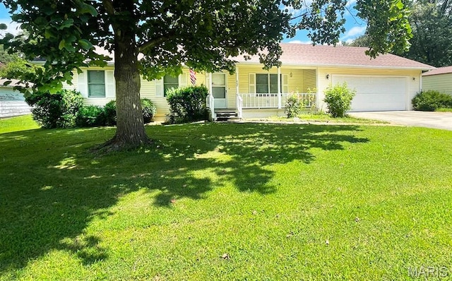402 N Viola St, Bloomfield, MO 63825 - view of front of property with an attached garage, driveway, covered porch, and a front lawn