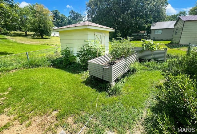402 N Viola St, Bloomfield, MO 63825 - view of yard featuring a vegetable garden