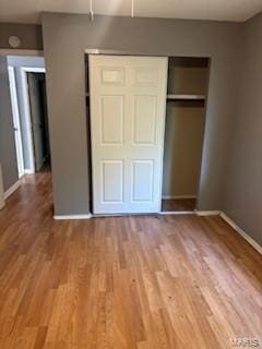 2623 Hord Ave, Jennings, MO 63136 - unfurnished bedroom featuring a closet and wood finished floors