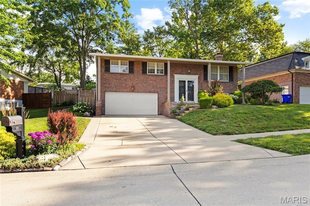 1225 Wissmann Dr, Ballwin, MO 63011 - raised ranch with brick siding, driveway, a garage, and a chimney