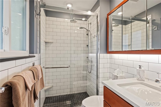 1225 Wissmann Dr, Ballwin, MO 63011 - full bath featuring tile walls, vanity, and a stall shower