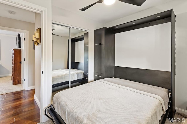 1225 Wissmann Dr, Ballwin, MO 63011 - bedroom featuring wood-type flooring, a closet, and ceiling fan