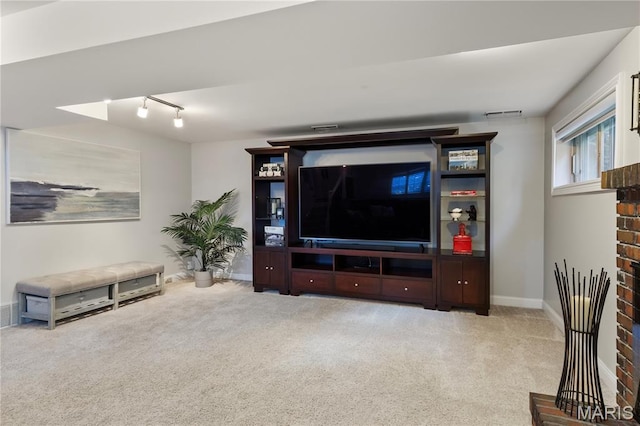 1225 Wissmann Dr, Ballwin, MO 63011 - carpeted living area featuring track lighting and baseboards