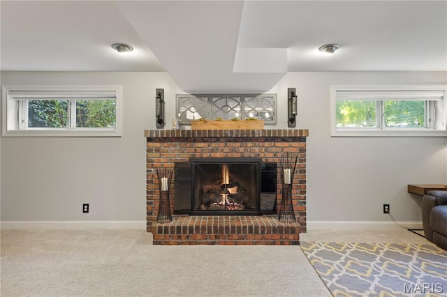 1225 Wissmann Dr, Ballwin, MO 63011 - carpeted living area with a brick fireplace and plenty of natural light