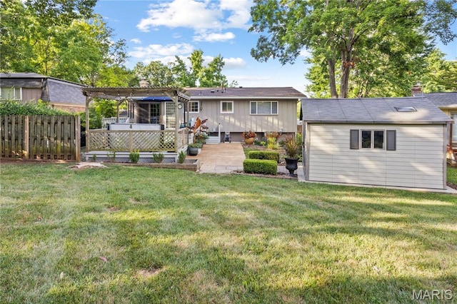 1225 Wissmann Dr, Ballwin, MO 63011 - rear view of property with a chimney, an outdoor structure, and a patio area