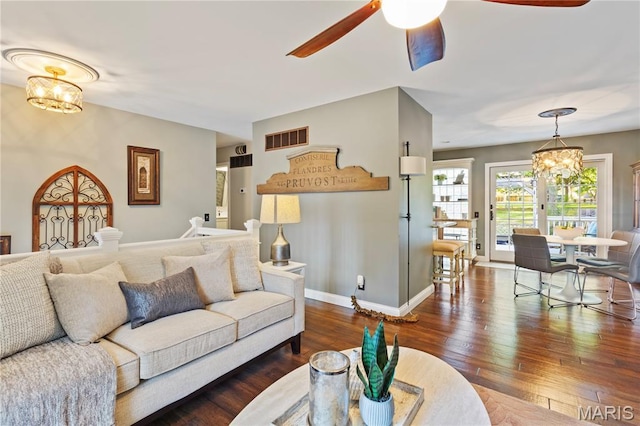 1225 Wissmann Dr, Ballwin, MO 63011 - living area with a chandelier, a ceiling fan, and wood-type flooring