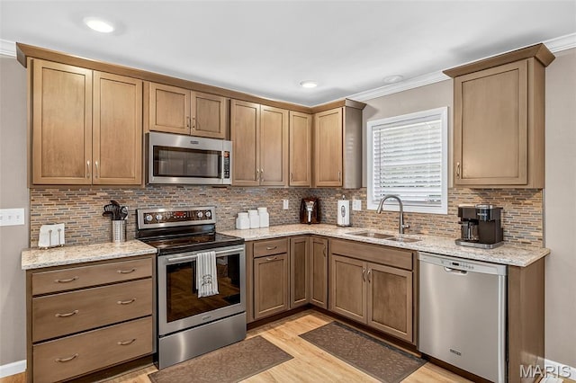 11178 Catatoga Dr, Plainview, IL 62685 - kitchen with stainless steel appliances, light wood finished floors, backsplash, ornamental molding, and light stone counters