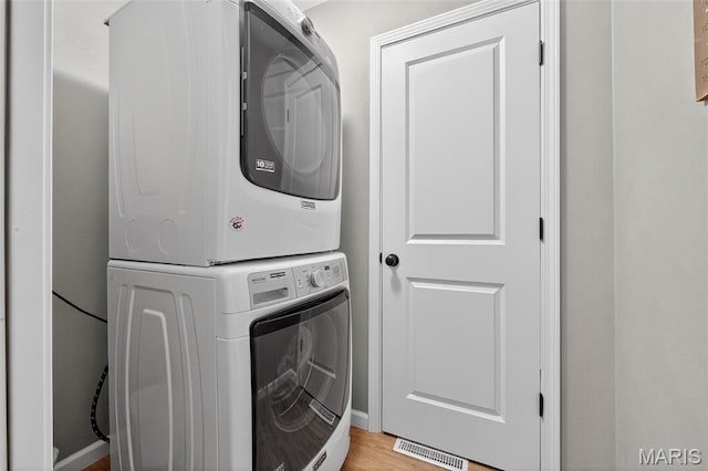 11178 Catatoga Dr, Plainview, IL 62685 - laundry room with estacked washer and dryer and light wood-style flooring