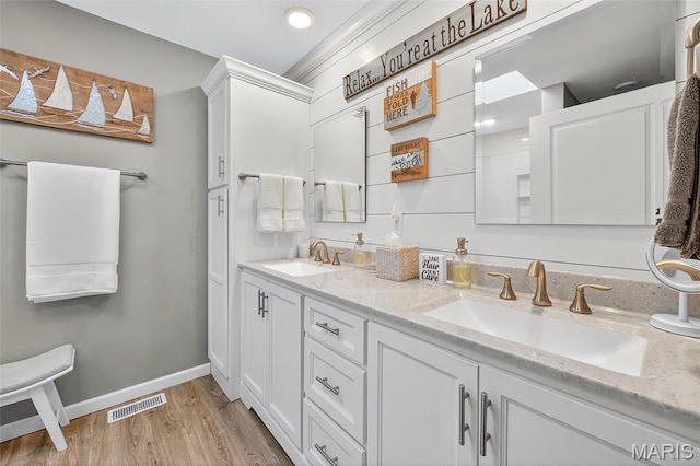 11178 Catatoga Dr, Plainview, IL 62685 - bathroom with double vanity and wood finished floors