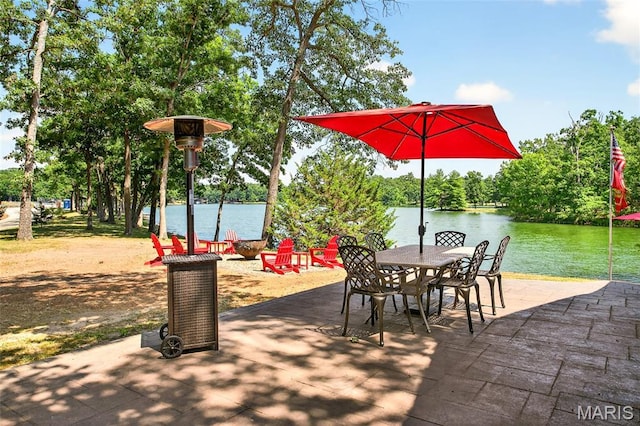 11178 Catatoga Dr, Plainview, IL 62685 - view of patio featuring a water view and outdoor dining space