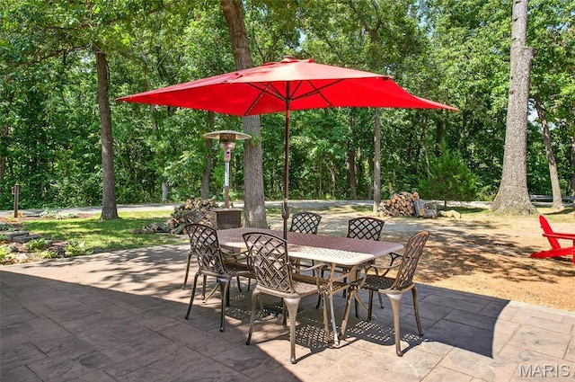11178 Catatoga Dr, Plainview, IL 62685 - view of patio / terrace featuring outdoor dining space and view of wooded area