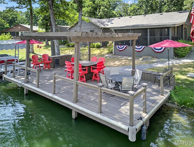11178 Catatoga Dr, Plainview, IL 62685 - dock area featuring outdoor dining space, a deck with water view, and view of scattered trees